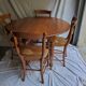 Round table, Louis Philippe style, antique patina, its 2 extensions and 4 chairs