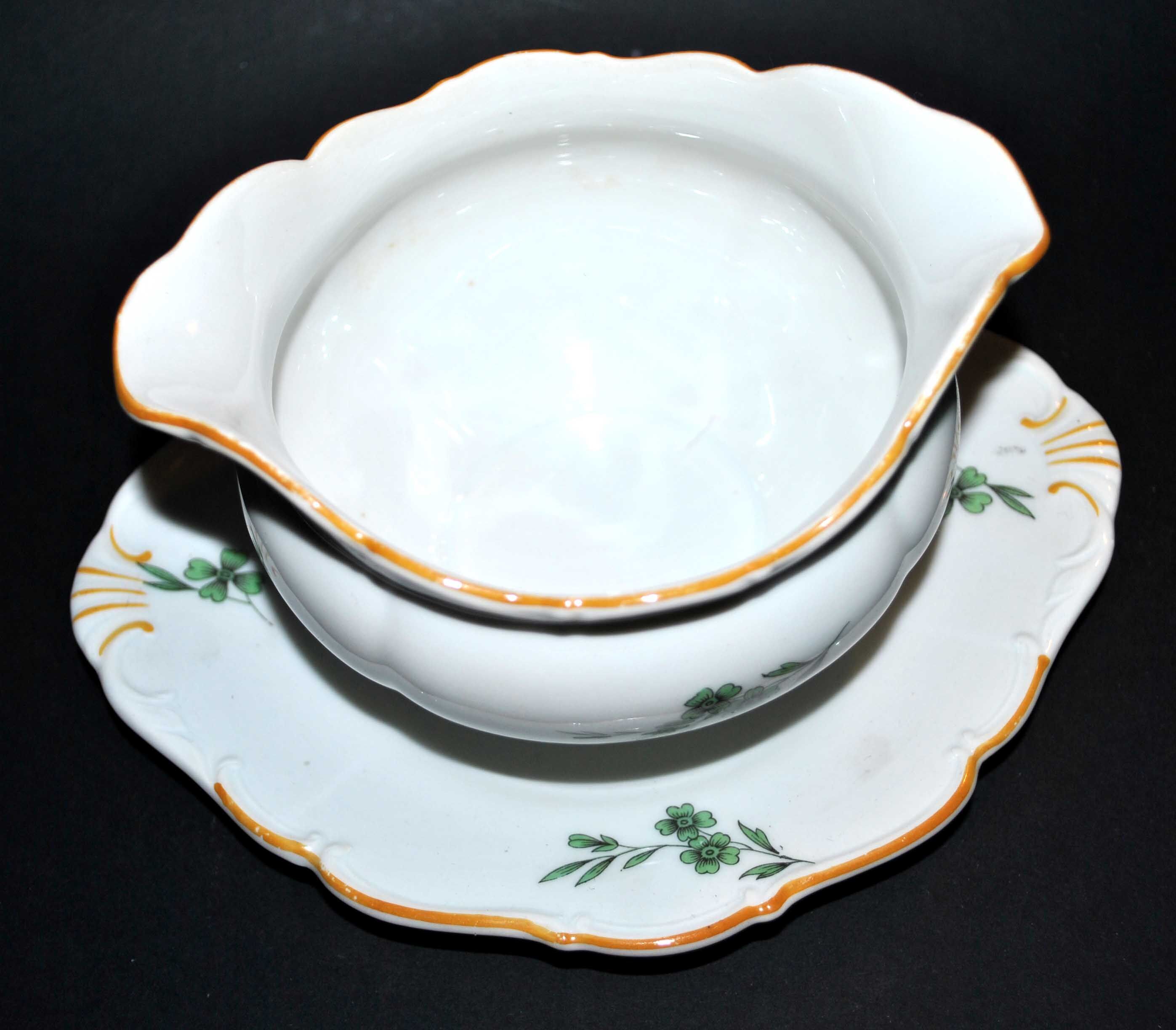 Vintage porcelain pouring saucière decorated with green clover