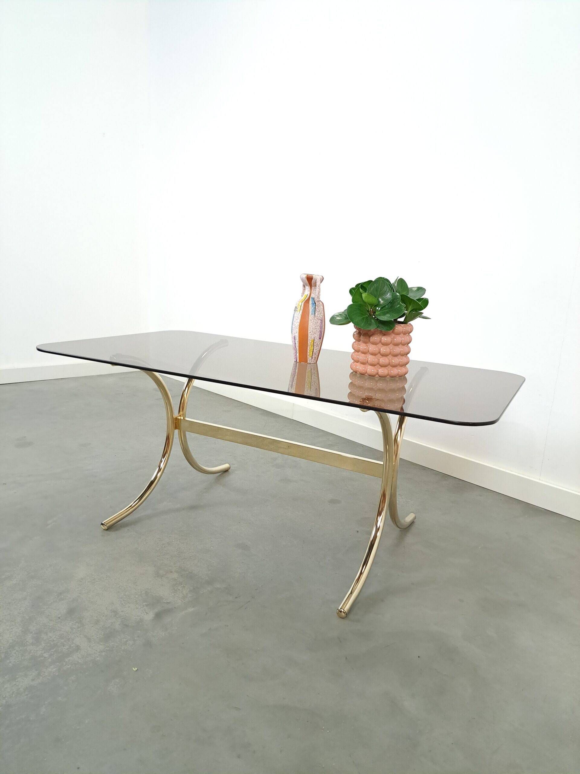 Smoked glass coffee table with gold-coloured legs from Sweden