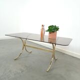 Smoked glass coffee table with gold-coloured legs from Sweden