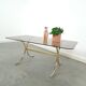 Smoked glass coffee table with gold-coloured legs from Sweden