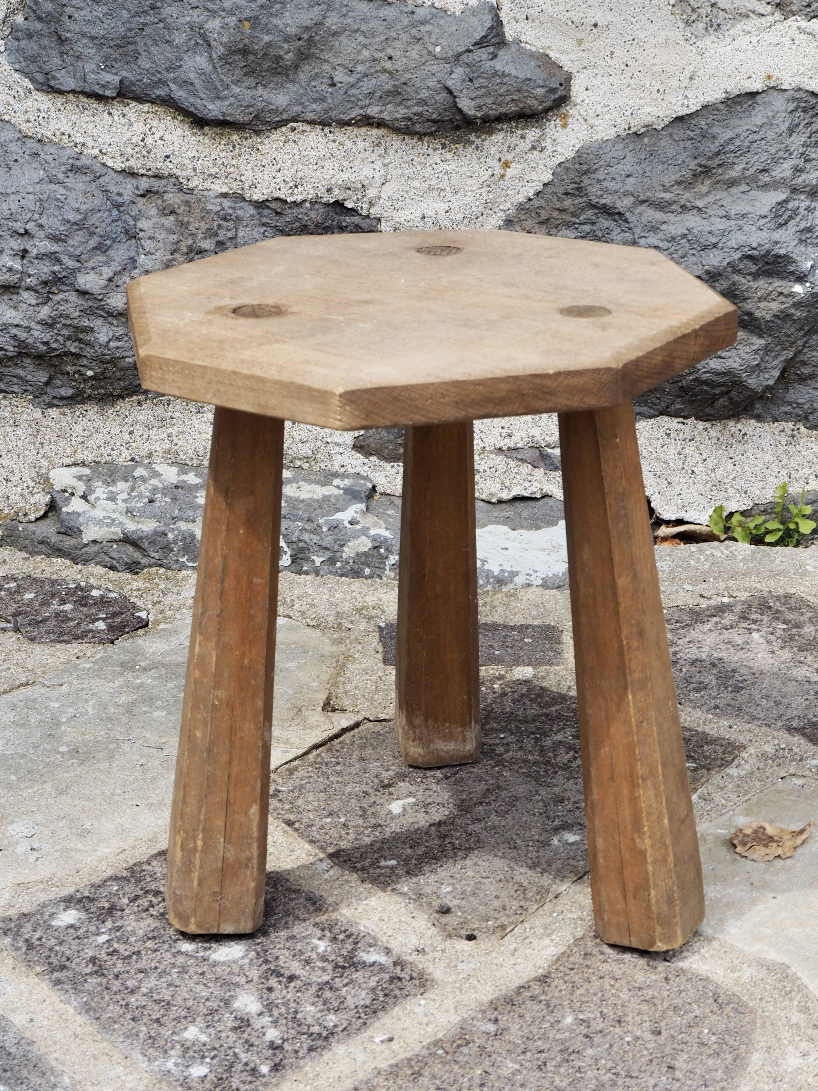 Raw wood tripod stool with octagonal seat