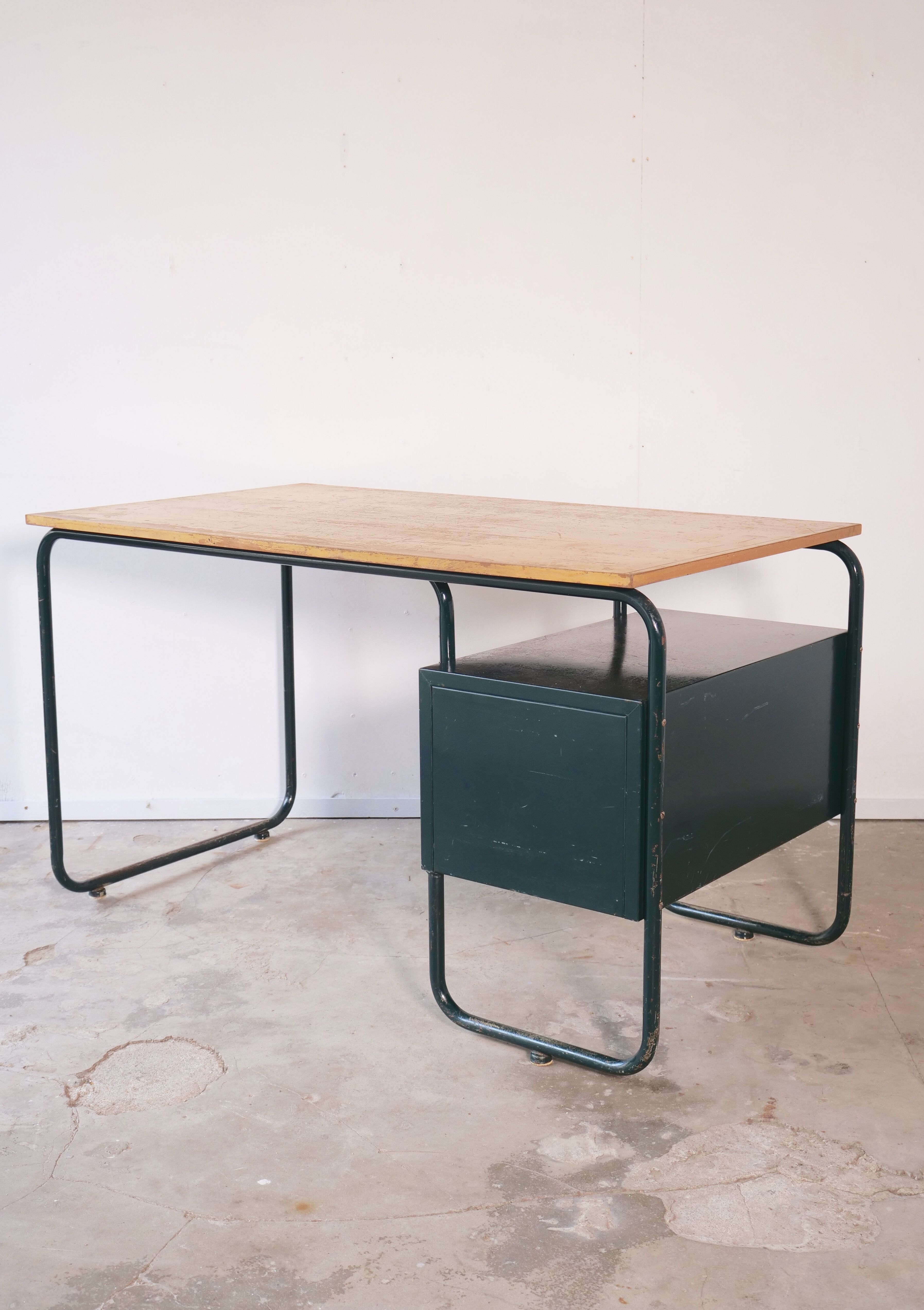 Desk with bauhaus style tubular steel chair