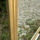 Miroir de style Louis Philippe en bois doré