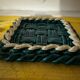 Woven ceramic trivet from Vallauris in the Massier style.