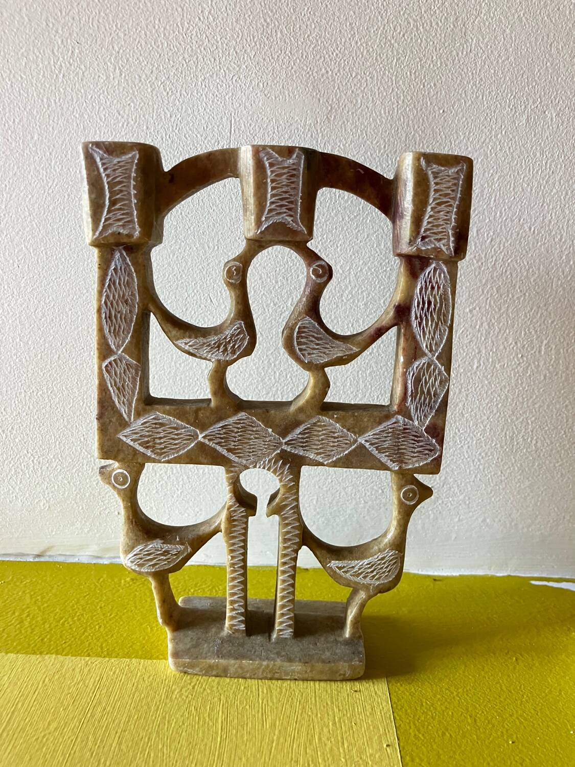 Vintage stone folk art candle holder