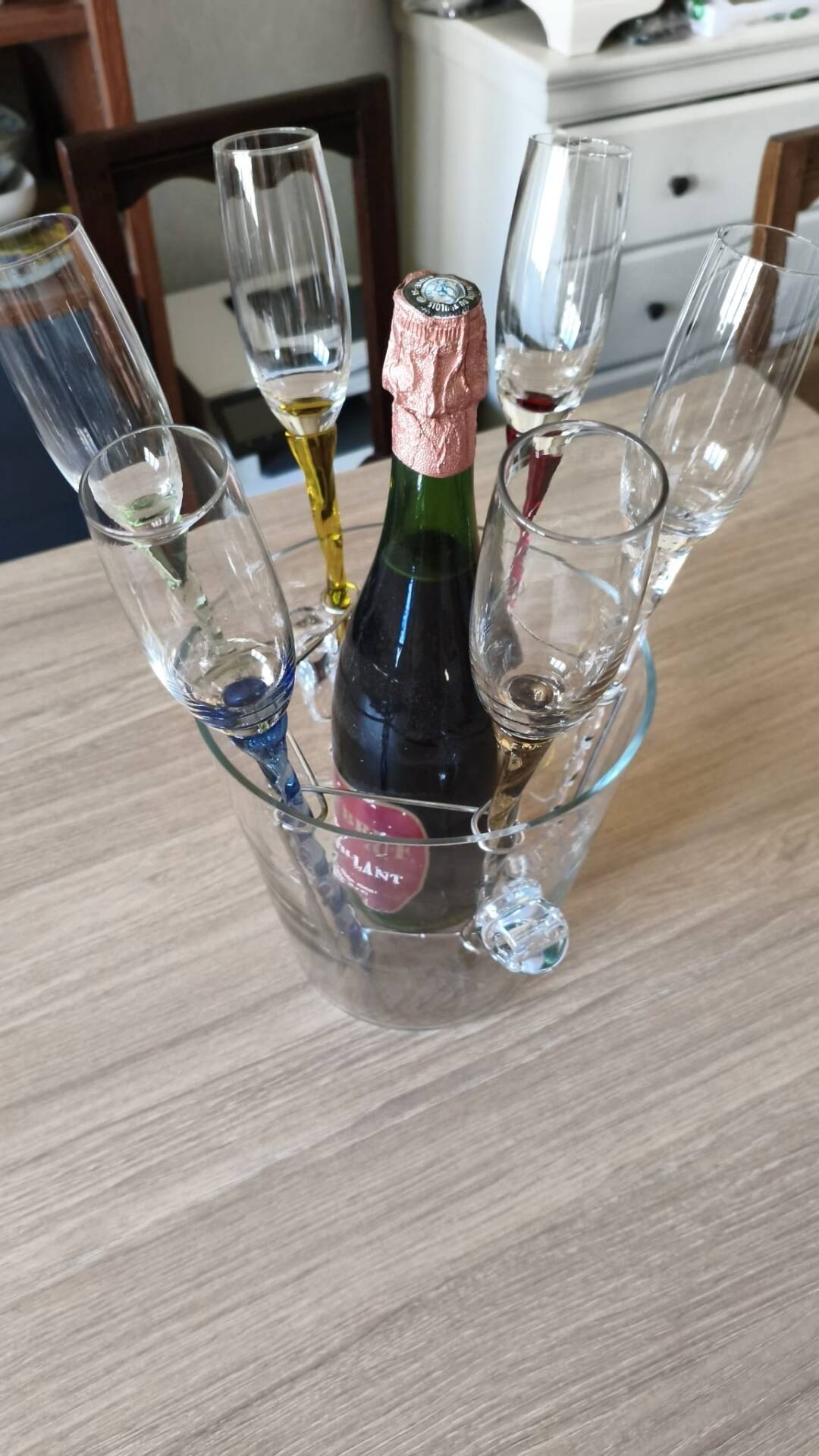 Crystal champagne flutes in their bucket