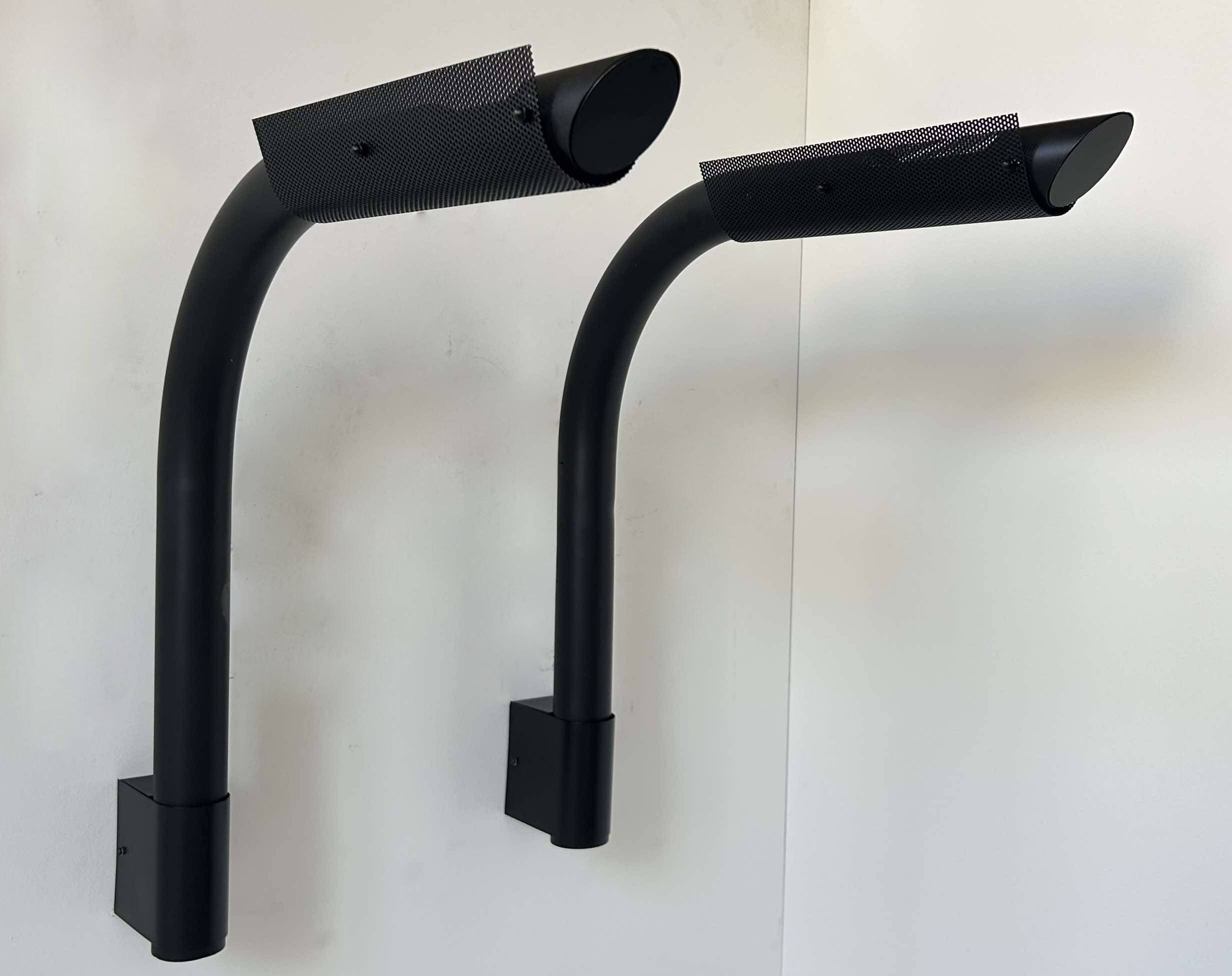 Pair of vintage wall lights, tubular and perforated black metal, Parscot France 1980