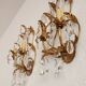 Hand-forged wall lamp gilded with gold leaf and crystals, Italy
