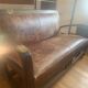 Vintage colonial-style bench in solid wood and patinated leather.