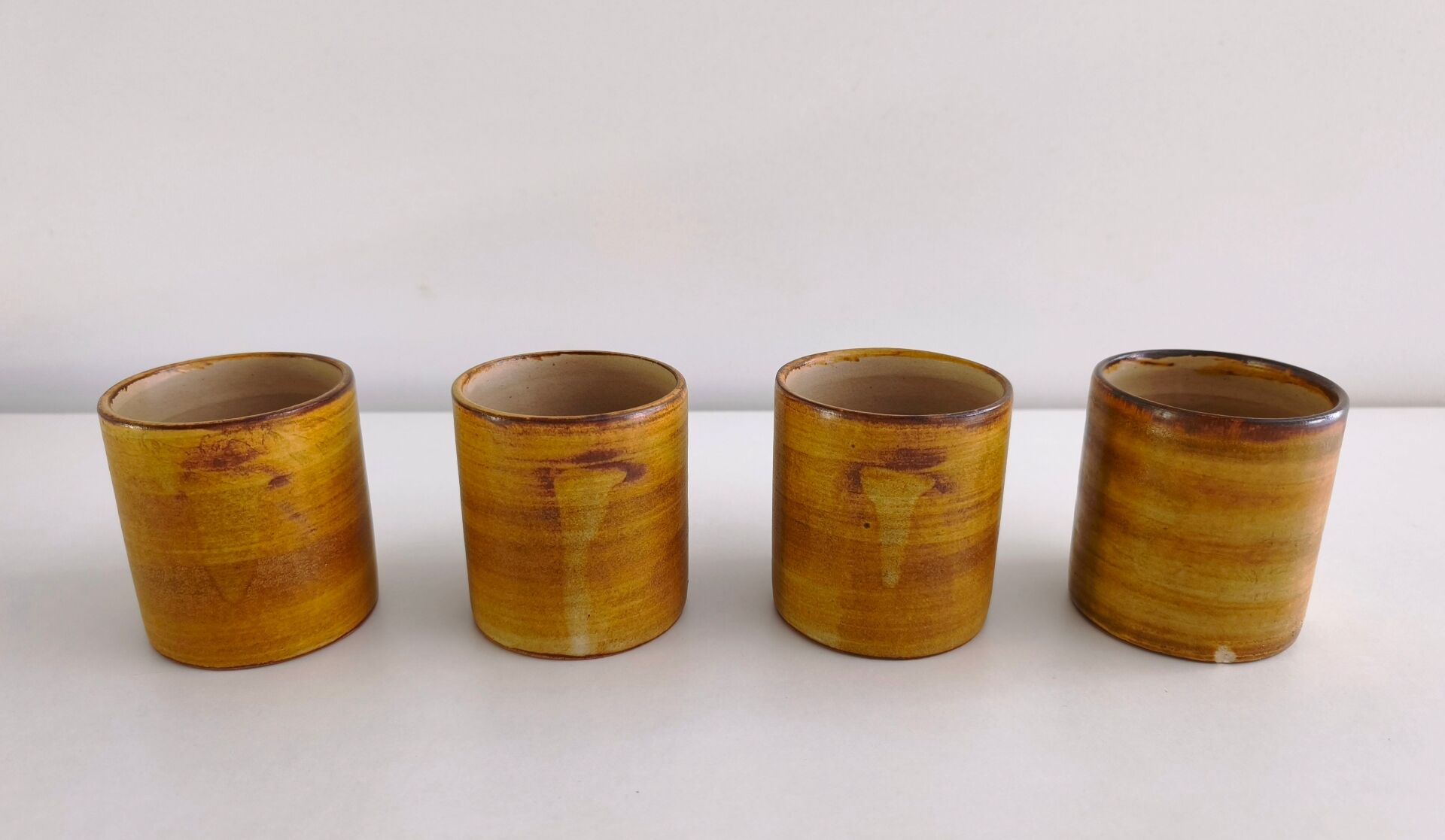 Set of 4 ceramic mugs signed Peyron