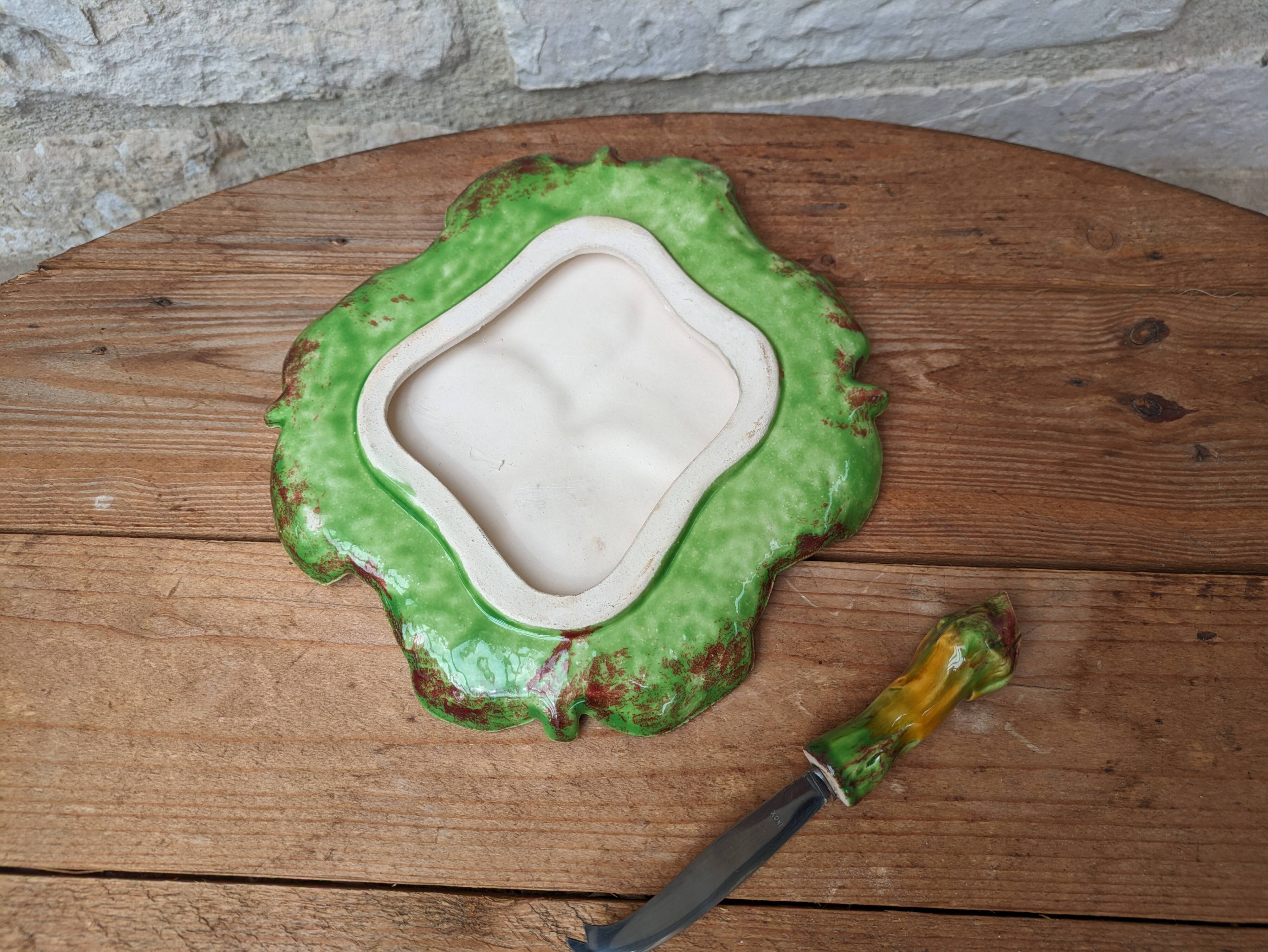 Antique colored ceramic cheese plate with knife
