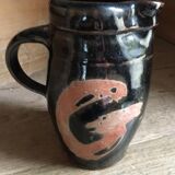 Ceramic pitcher. Belly shape. Motives on both sides