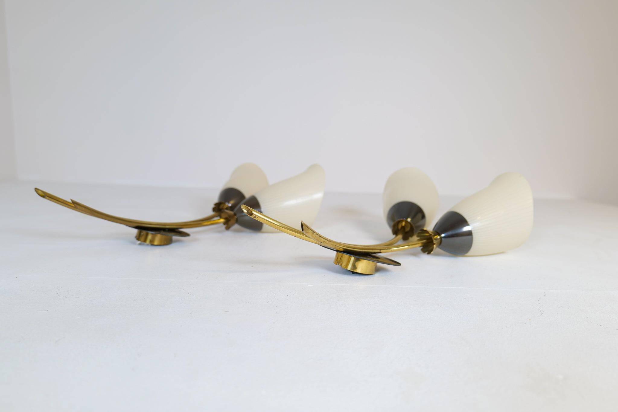 Mid-century pair of wall lamps in brass and opaline attributed to Asea Sweden, 1950s.