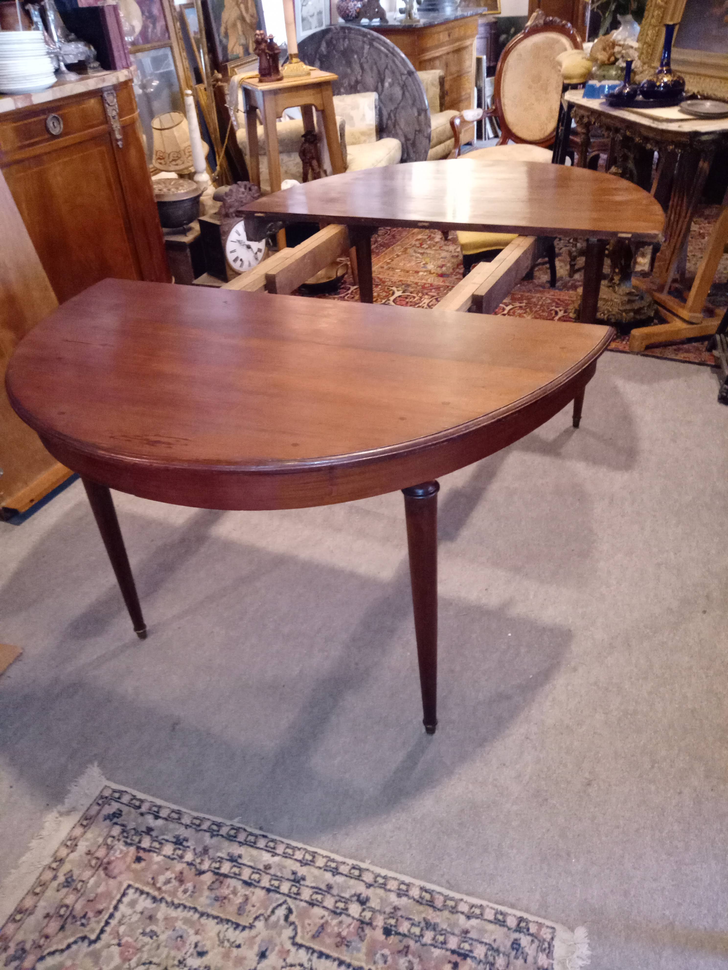 Oval mahogany table with extension cords
