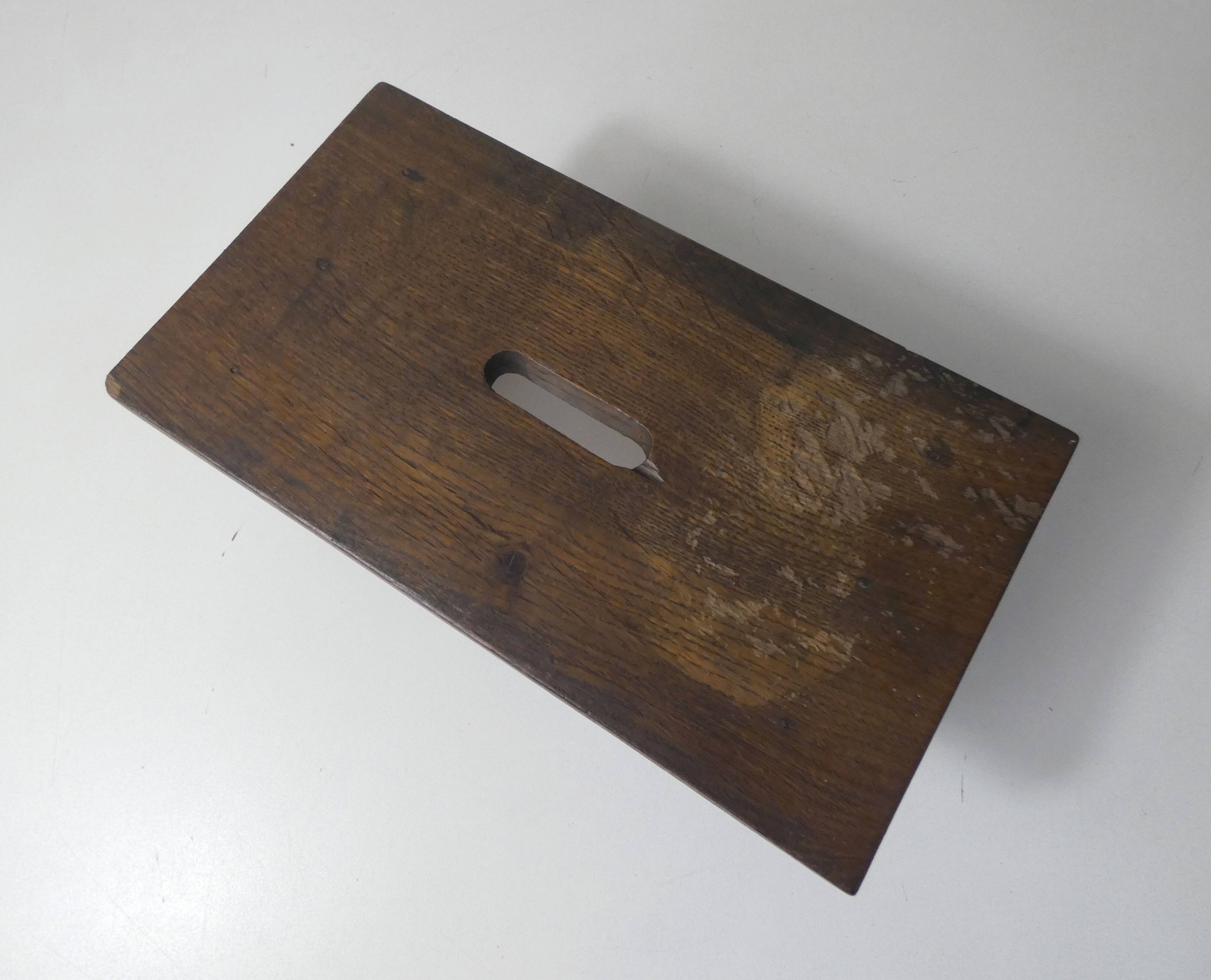 Old small wooden bench step in solid oak