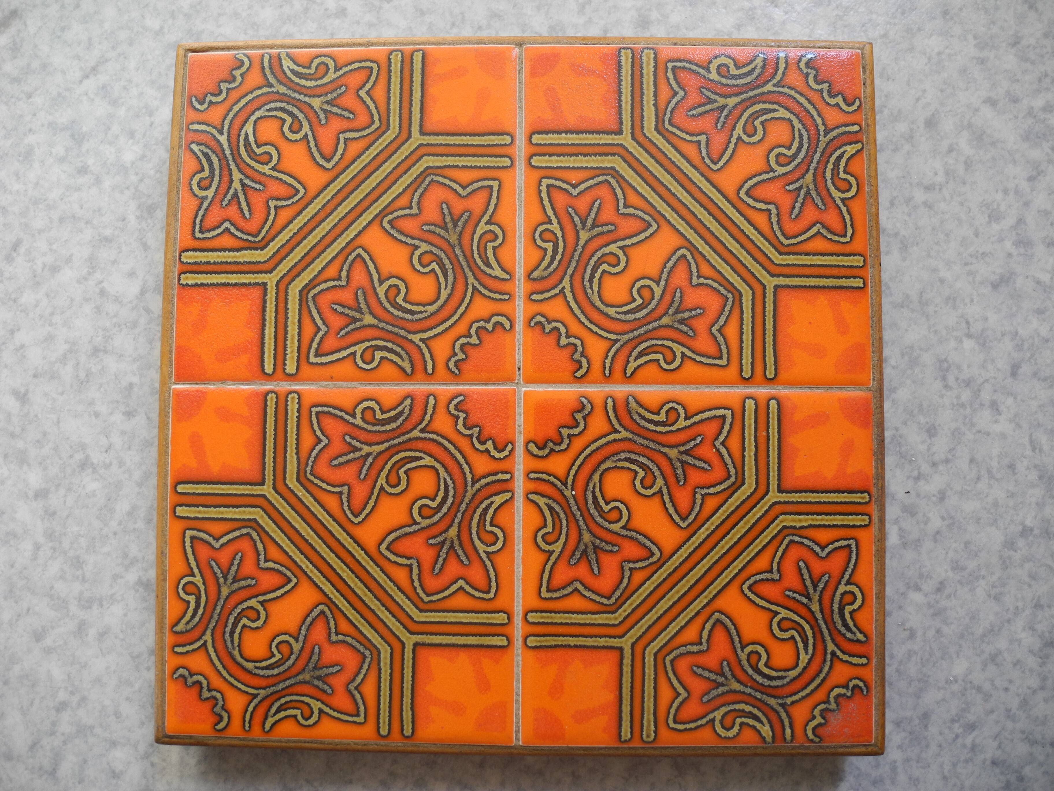old orange earthenware trivet vintage decor art table 70s