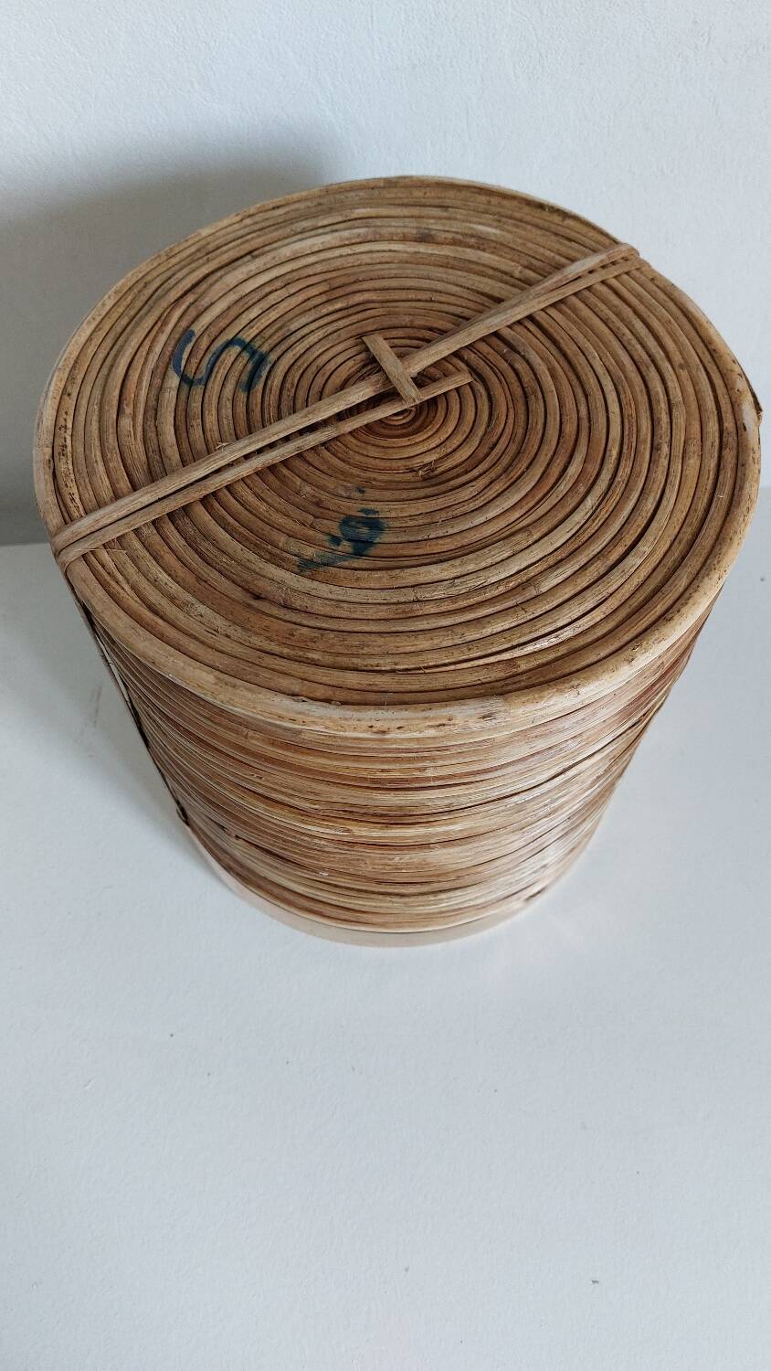 Rattan and brass pot cover