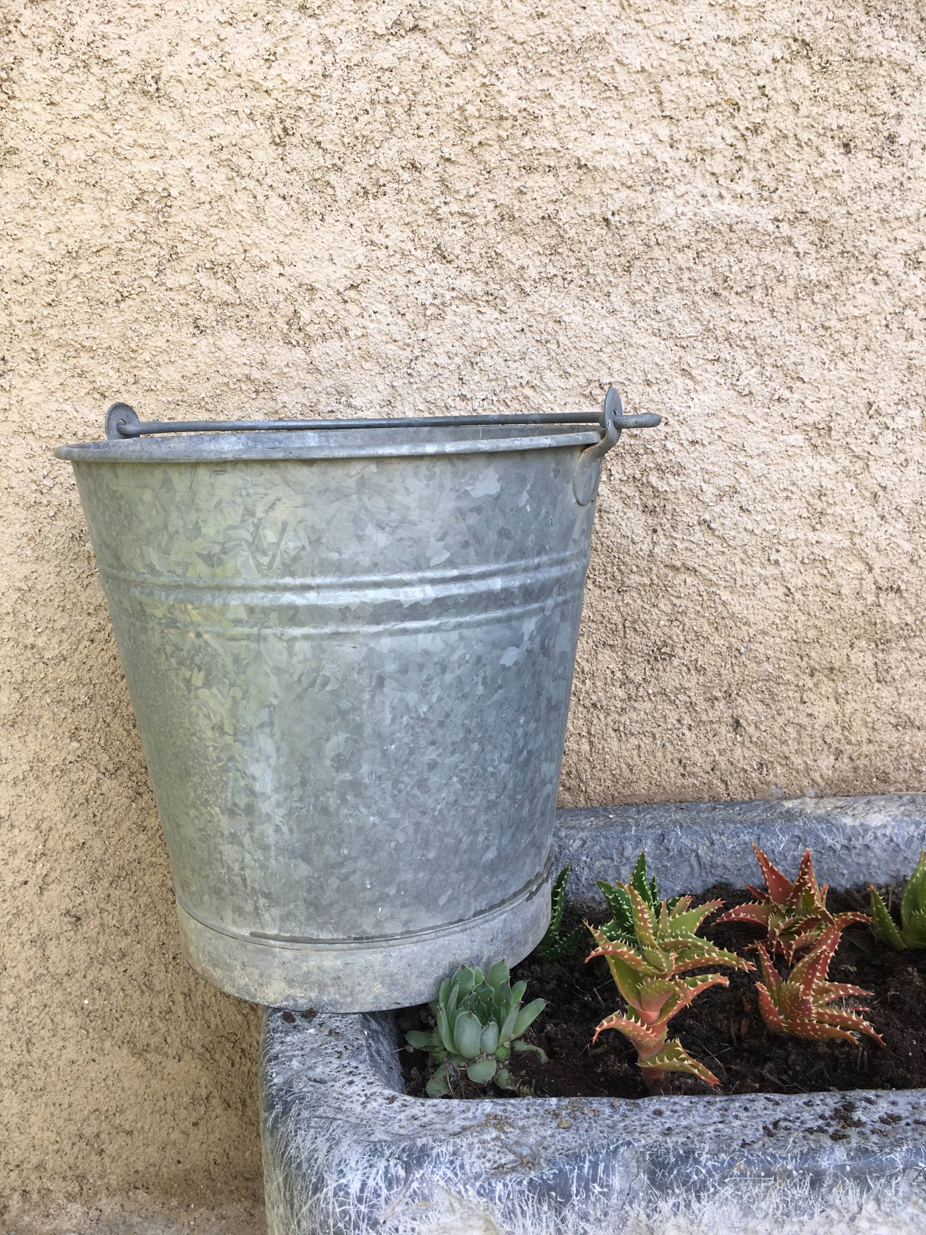 Old bucket in vintage zinc pot cache