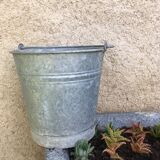 Old bucket in vintage zinc pot cache
