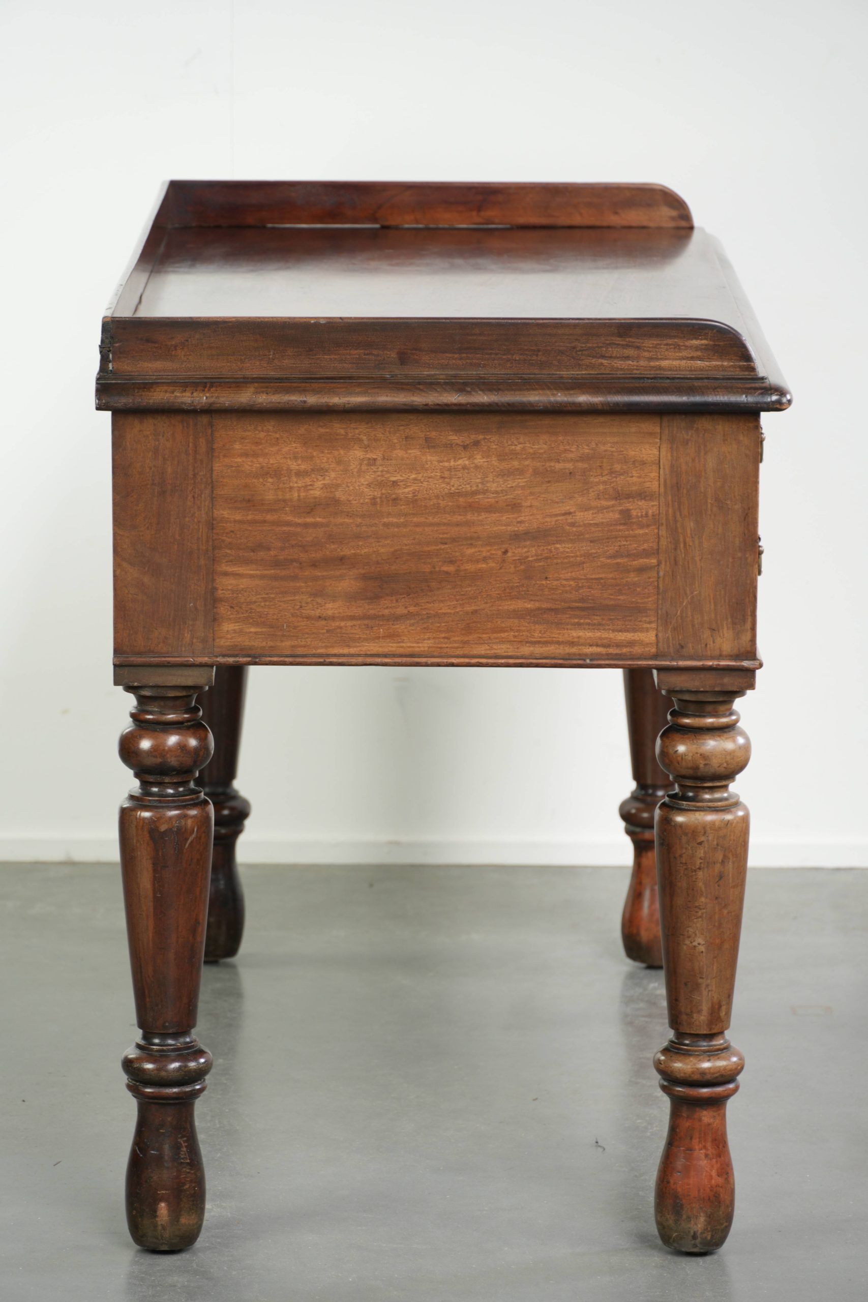 Elegant antique English desk / writing table from the mid-19th century
