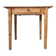 Small old farmhouse table in raw wood.