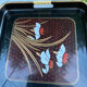 Vintage lacquered nesting tables duo – Floral decor and scoop handles.