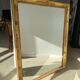 Miroir doré style Restauration à décor de palmettes étirées