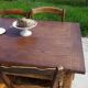 Old farmhouse table made entirely of restored solid oak.