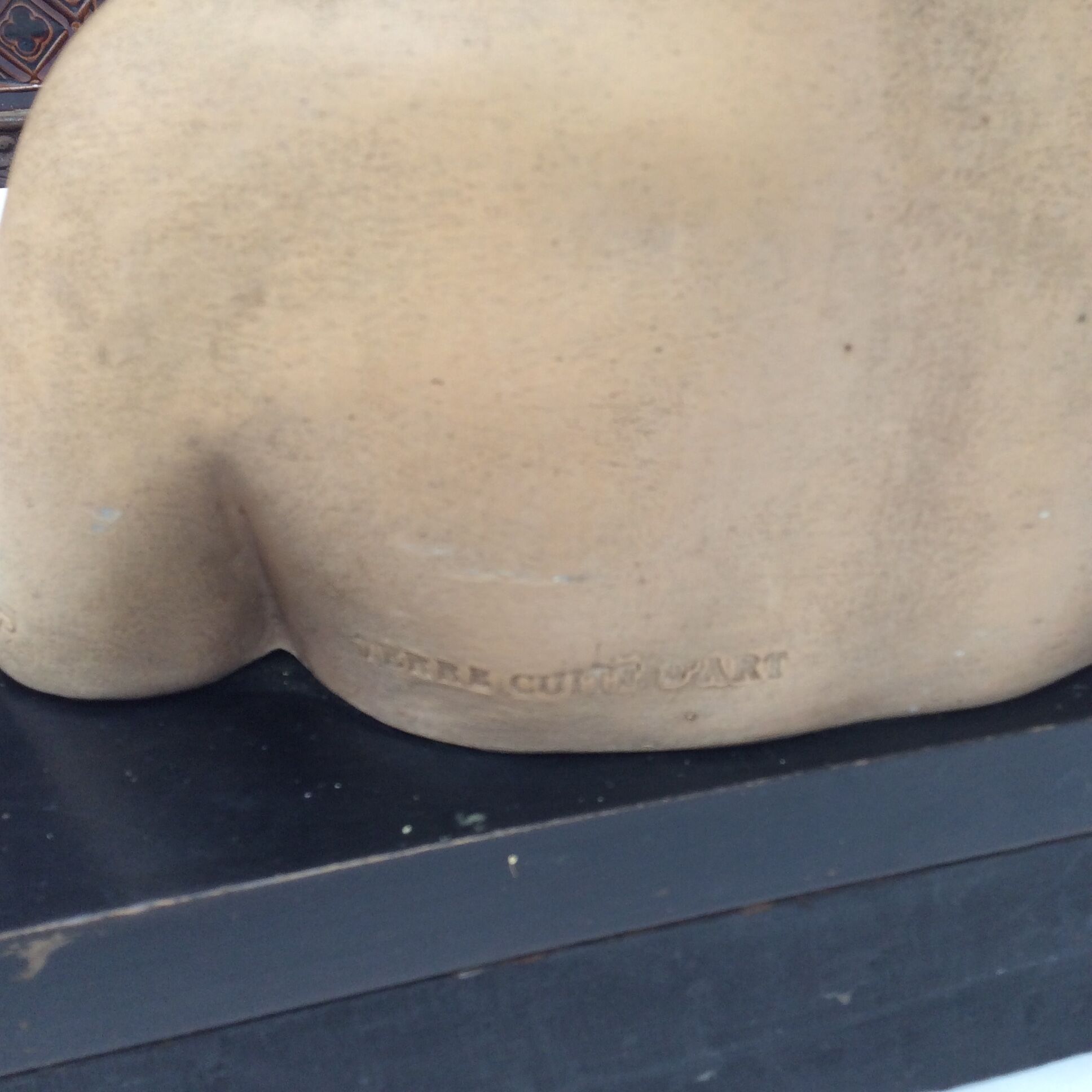 Girl's head in terracotta numbered