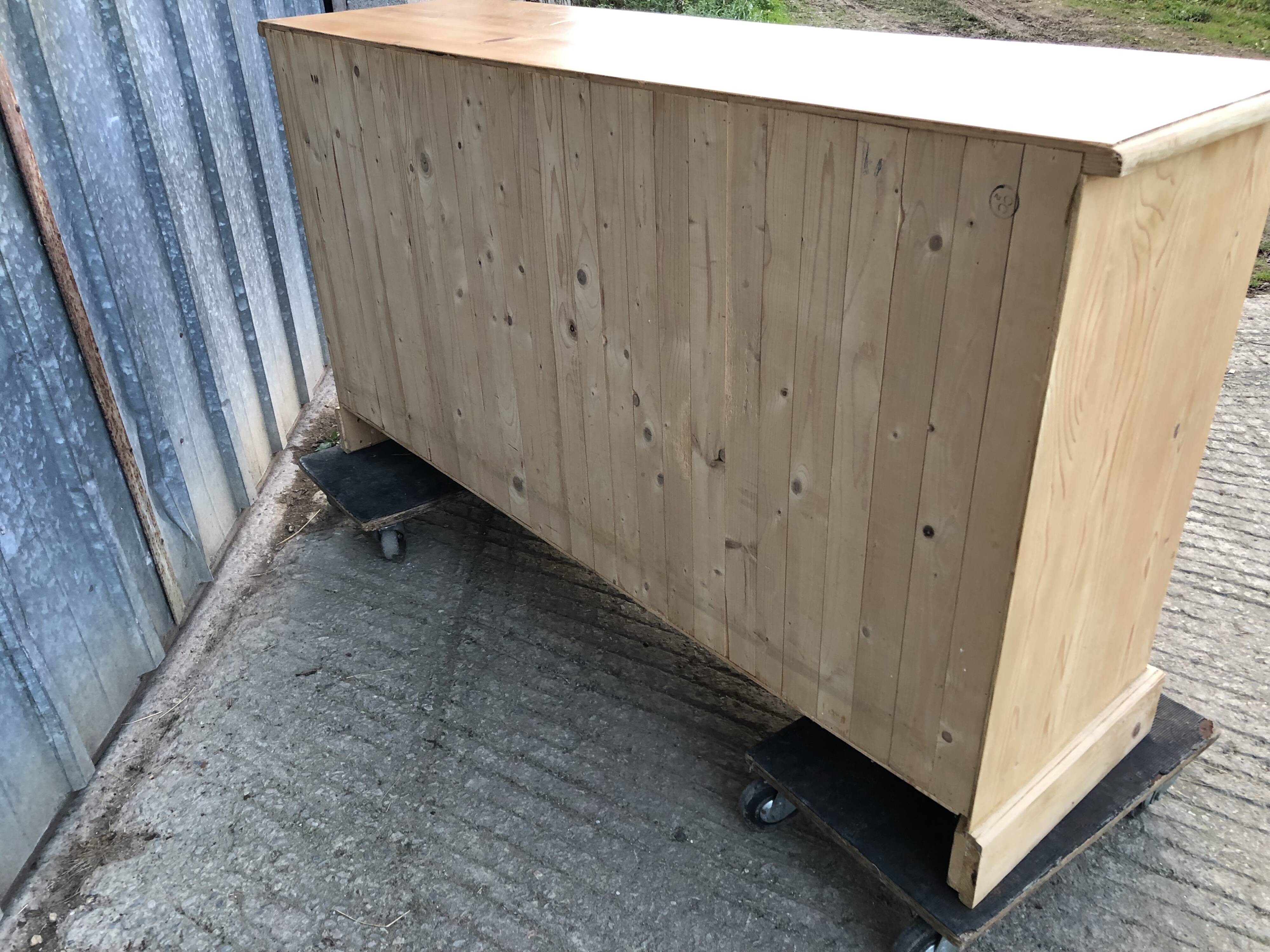 Scandinavian natural pine sideboard with 4 doors and 6 drawers.