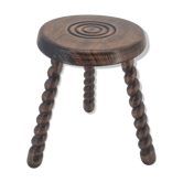 Tabouret brutaliste tripode en bois massif tourné