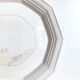 Round vintage Niderviller plate with a country decor.