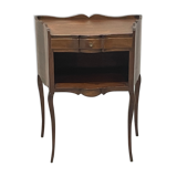 Stylized bedside table with curved shapes