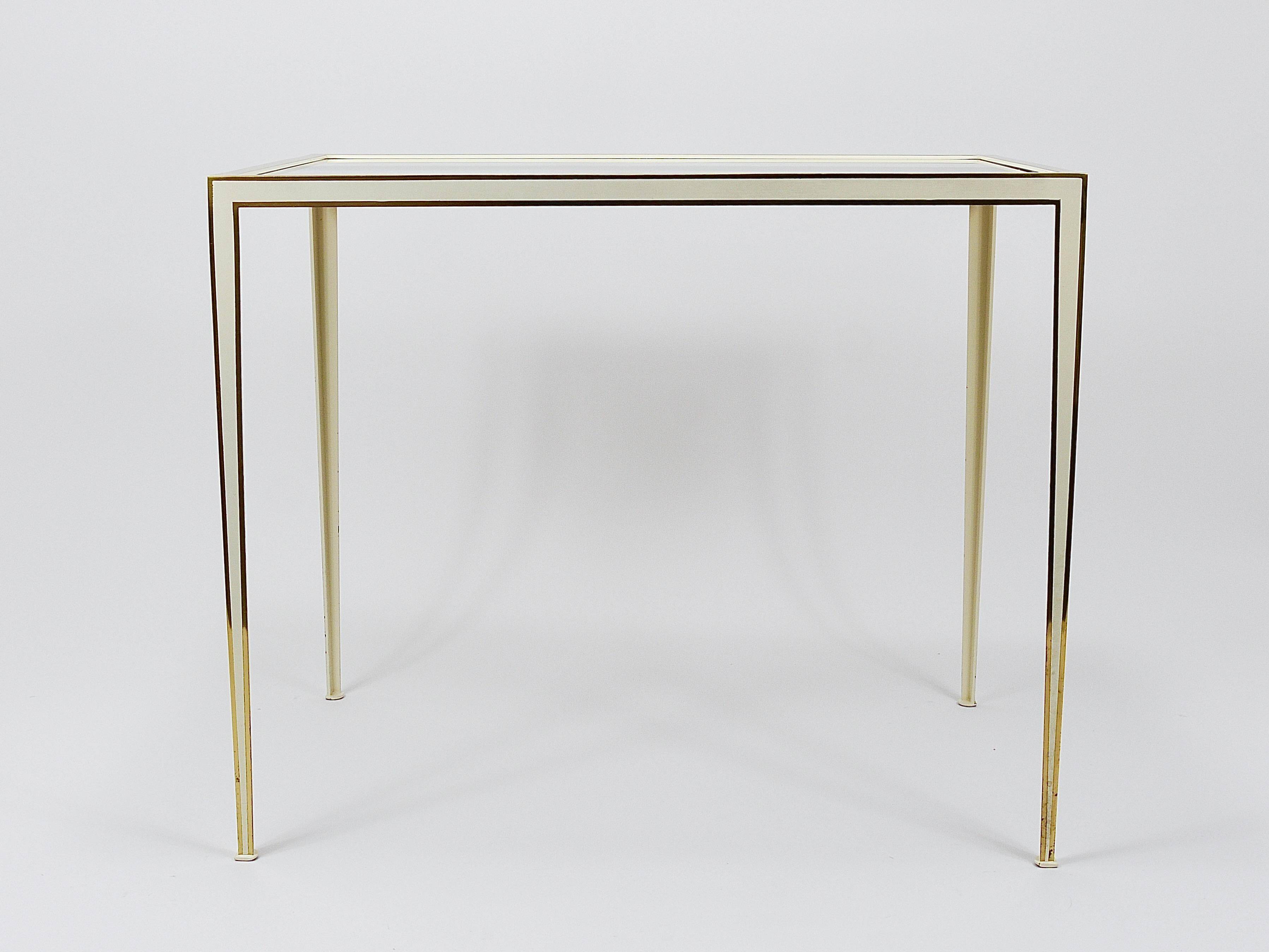 A pair of brass and white mirror tables from Vereinigte Werkstätten, Germany, 1970s.