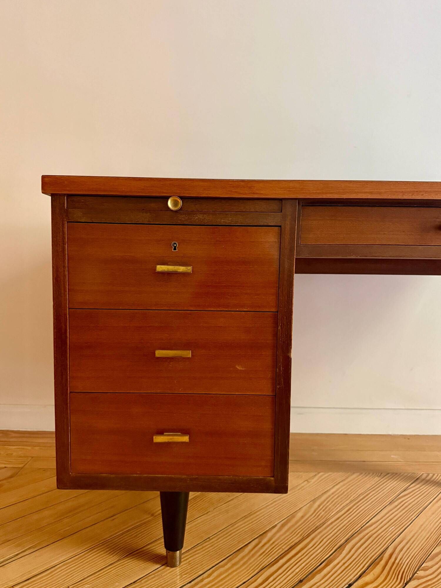 French desk "Prouve" in walnut, bronze and rubber from the 1970s.