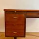 French desk "Prouve" in walnut, bronze and rubber from the 1970s.