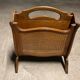 Vintage wicker newspaper rack
