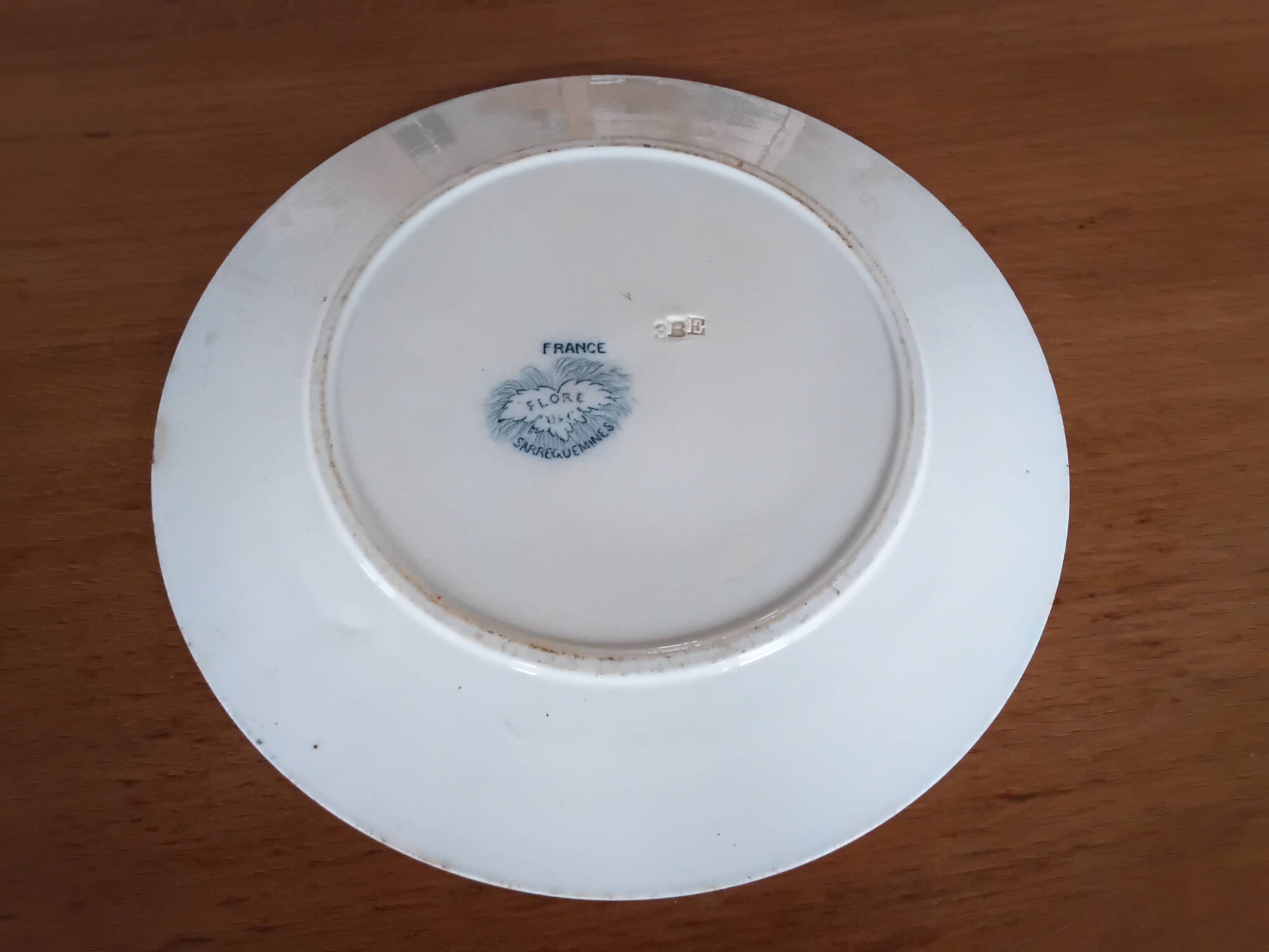 Two antique flat plates from Sarreguemines.