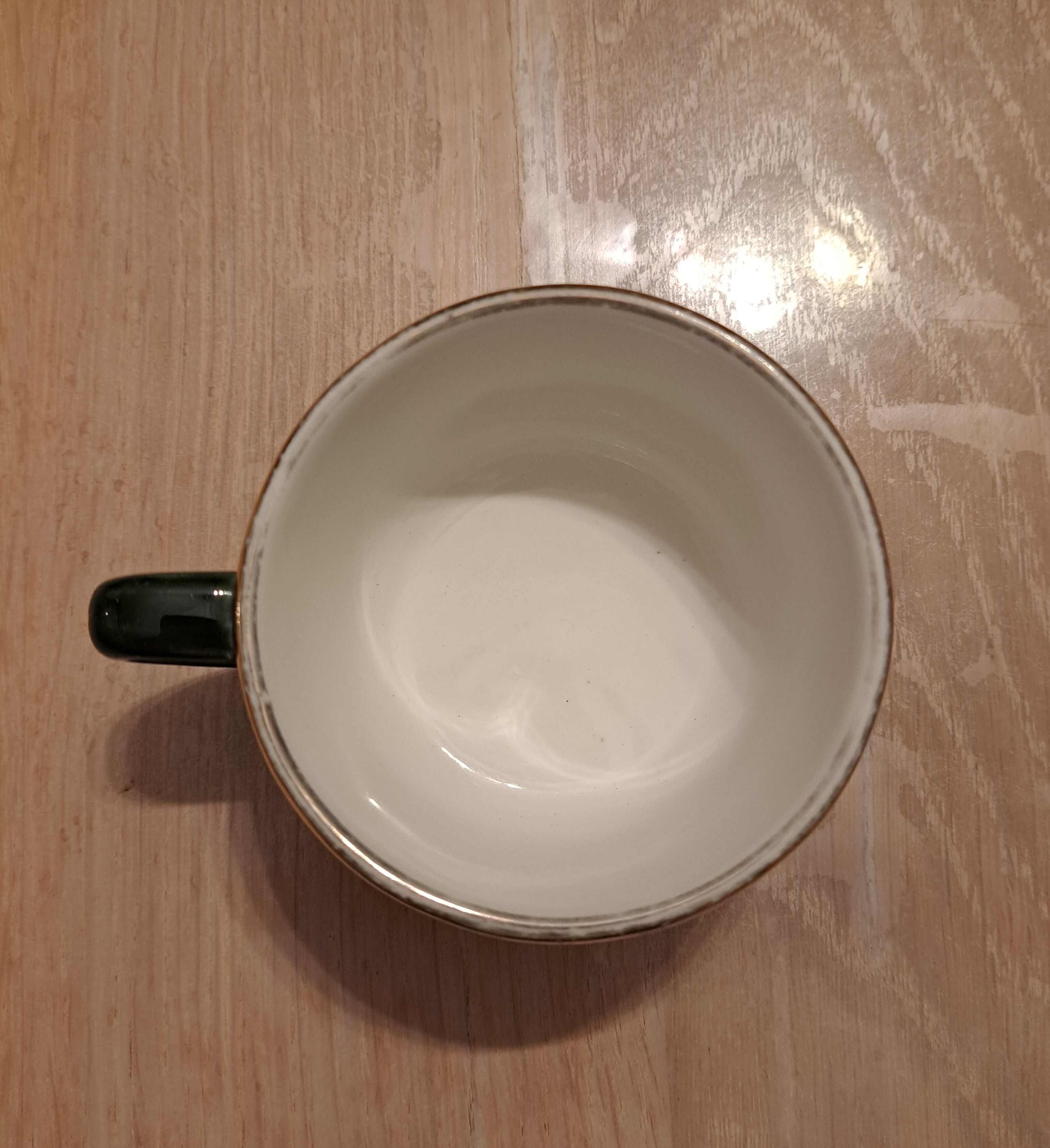 Green and gold coffee cups and sub-cups