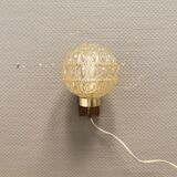 Wall light in rosewood with bobble glass ball shade.