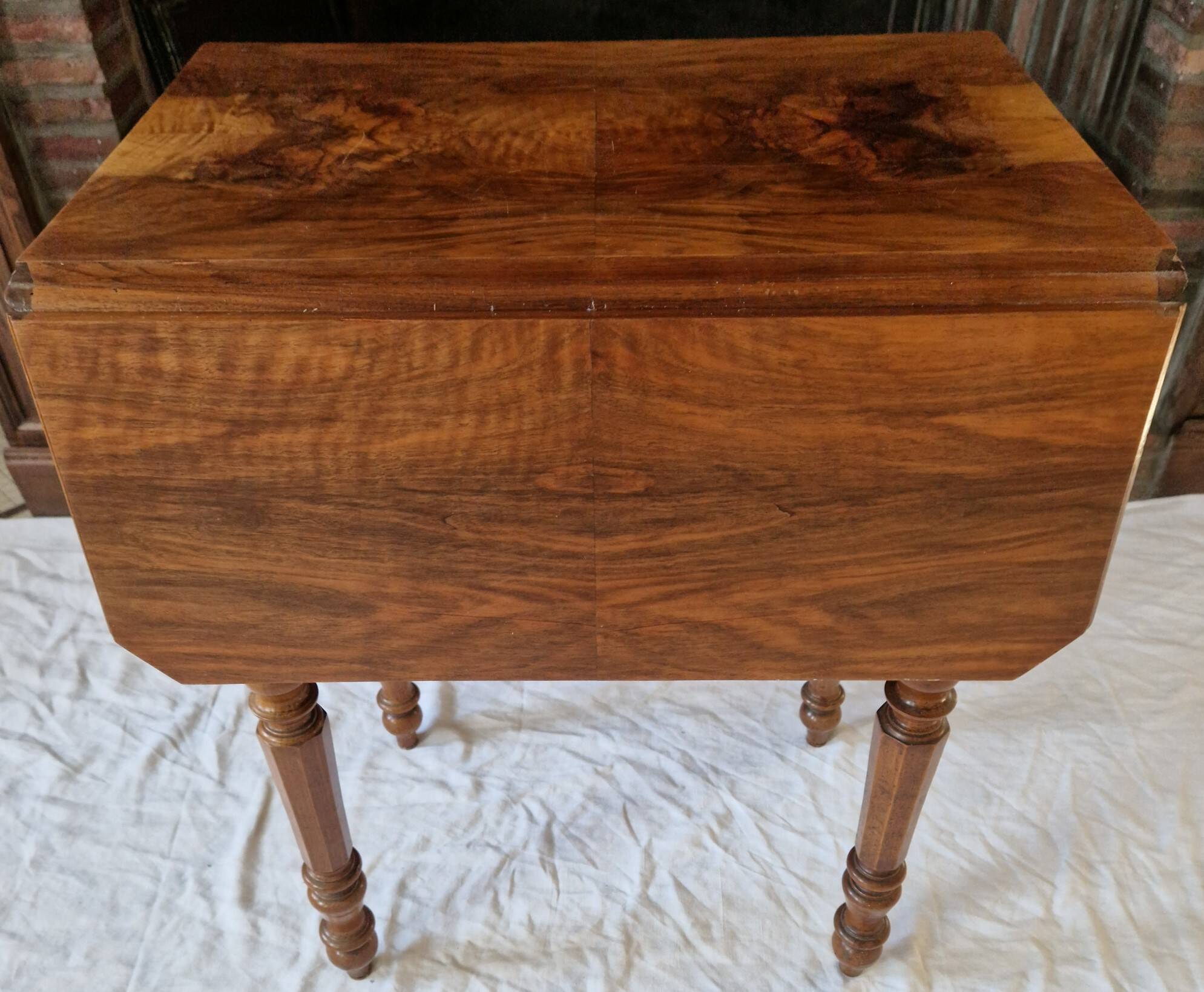 Nineteenth-century walnut work table with flaps, large storage + secret drawer.