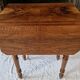 Nineteenth-century walnut work table with flaps, large storage + secret drawer.