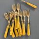 Brass and yellow galathite cake forks