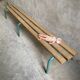 Vintage wood kindergarten bench and tubular structure in long