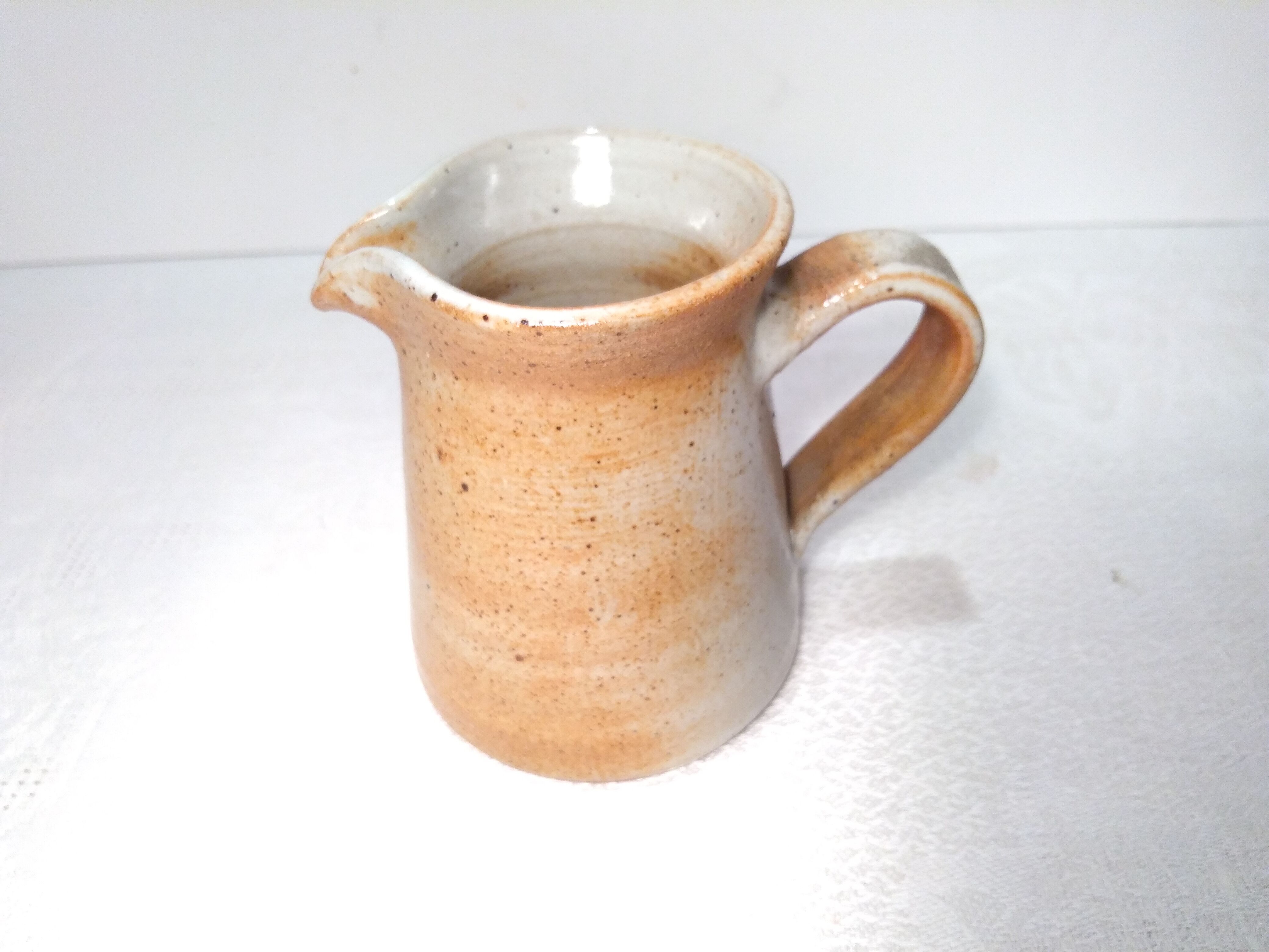 Vintage creamer in marsh sandstone