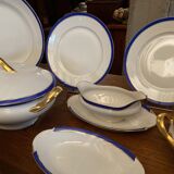 Limoges porcelain table service with blue band on white and gold background