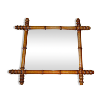 Mirror to the wooden frame imitating bamboo