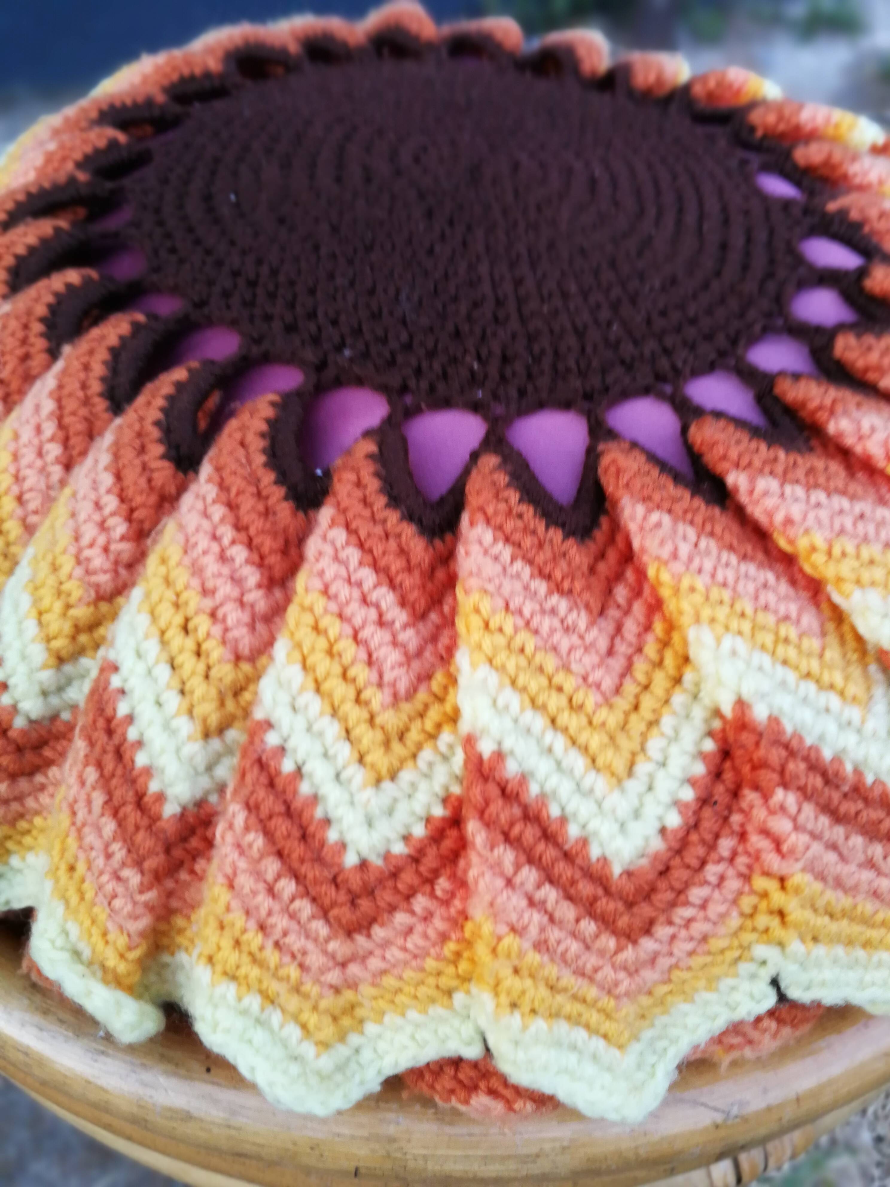 Rattan pouf and its 70's cushion