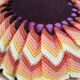 Pouf en rotin et son coussin 70's